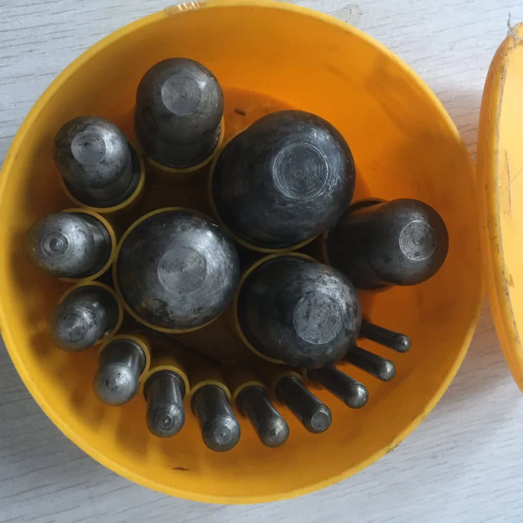 Gasket punch tools in a storage holder