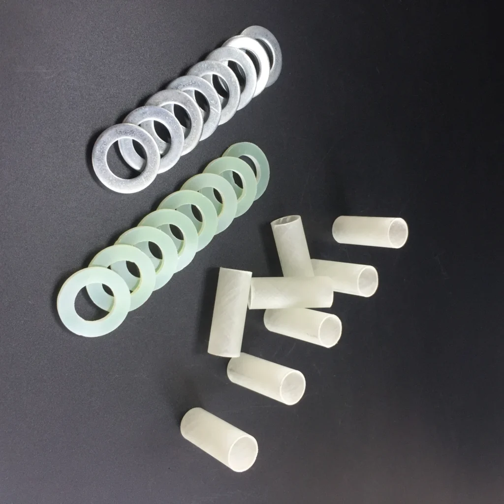Insulating sleeves with insulating and metal backup washers