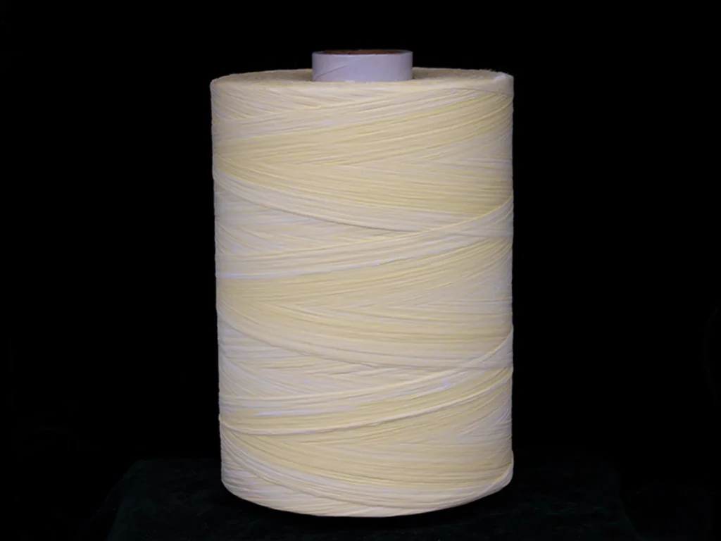 PTFE-treated aramid yarn on a spool
